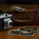 Photo of a vintage camera and photographs