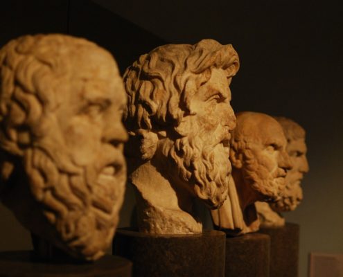 Four stone busts of philosophers