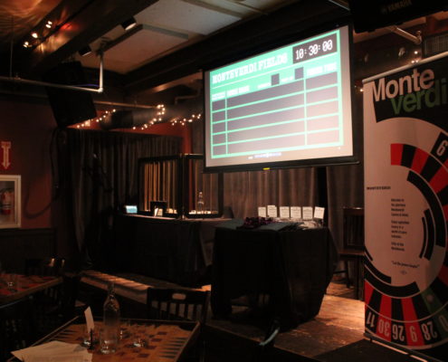 A projector and banners displaying puzzles for The Falswift Objective